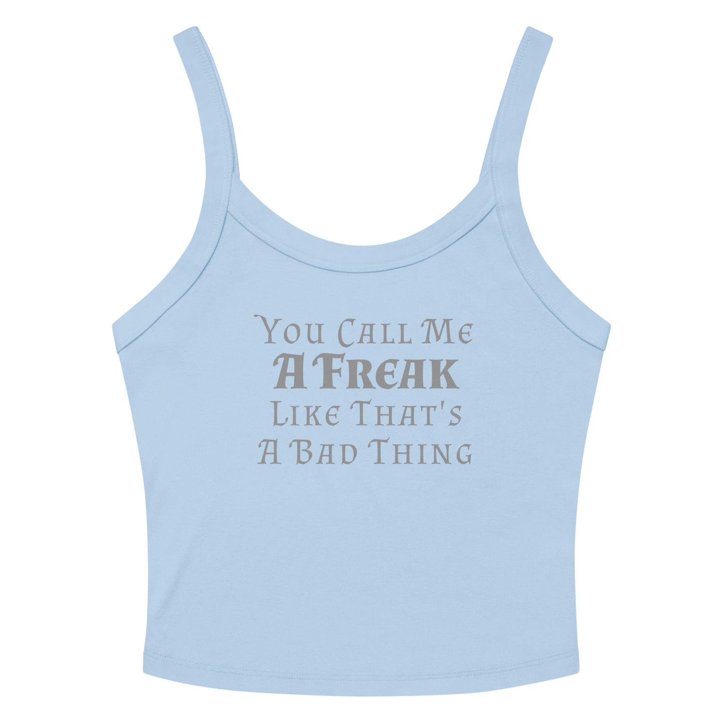 "You Call Me A Freak Like That's A Bad Thing" printed on a solid baby blue blend women's micro-rib tanktop laying on a flat surface amongst sunglasses and shorts
