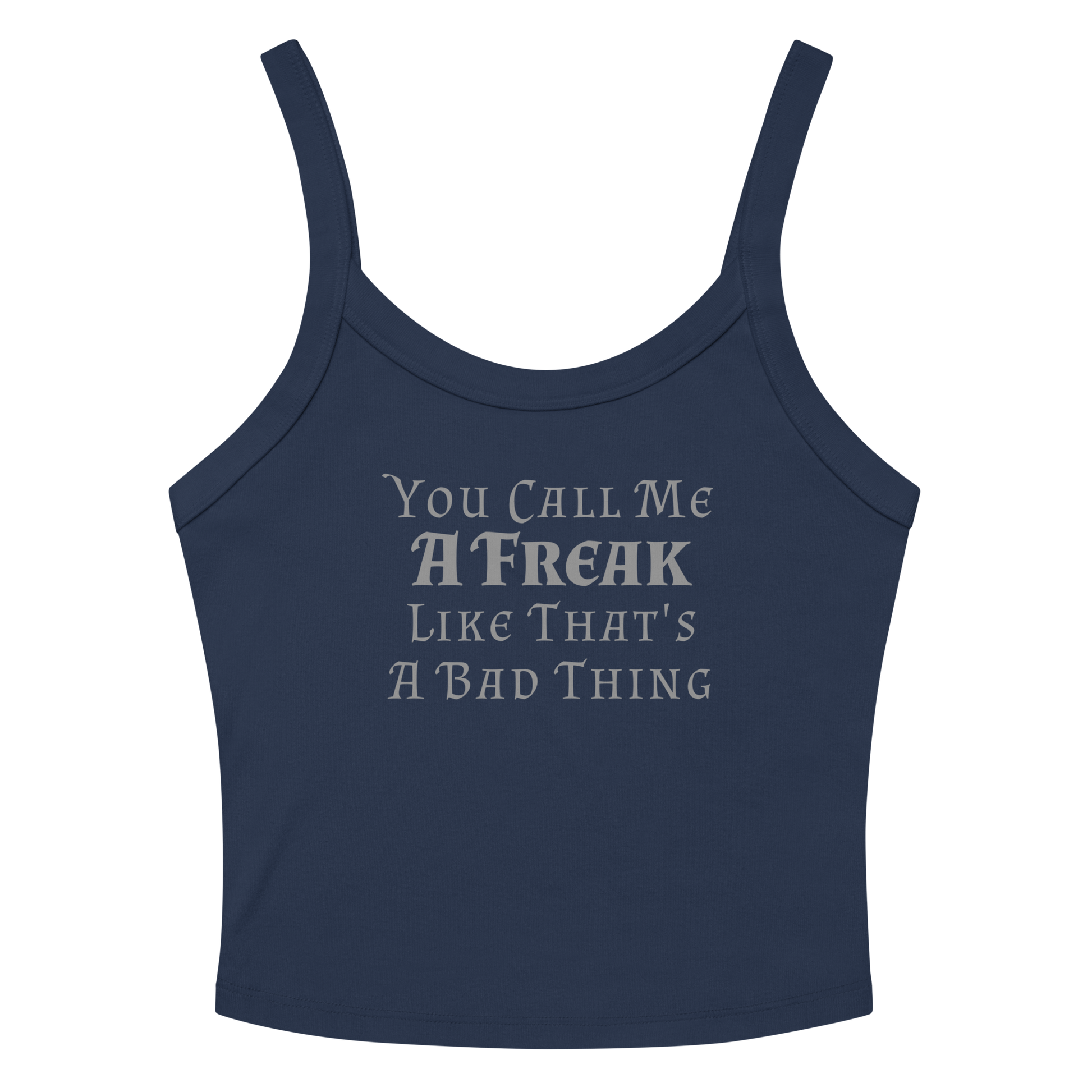"You Call Me A Freak Like That's A Bad Thing" printed on a solid navy blend women's micro-rib tanktop laying on a flat surface amongst sunglasses and shorts