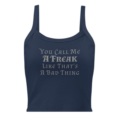 "You Call Me A Freak Like That's A Bad Thing" printed on a solid navy blend women's micro-rib tanktop laying on a flat surface