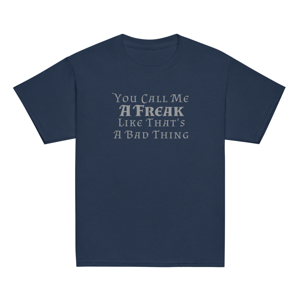 "You Call Me A Freak Like That's A Bad Thing" printed on a navy youth classic tee laying on a flat surface