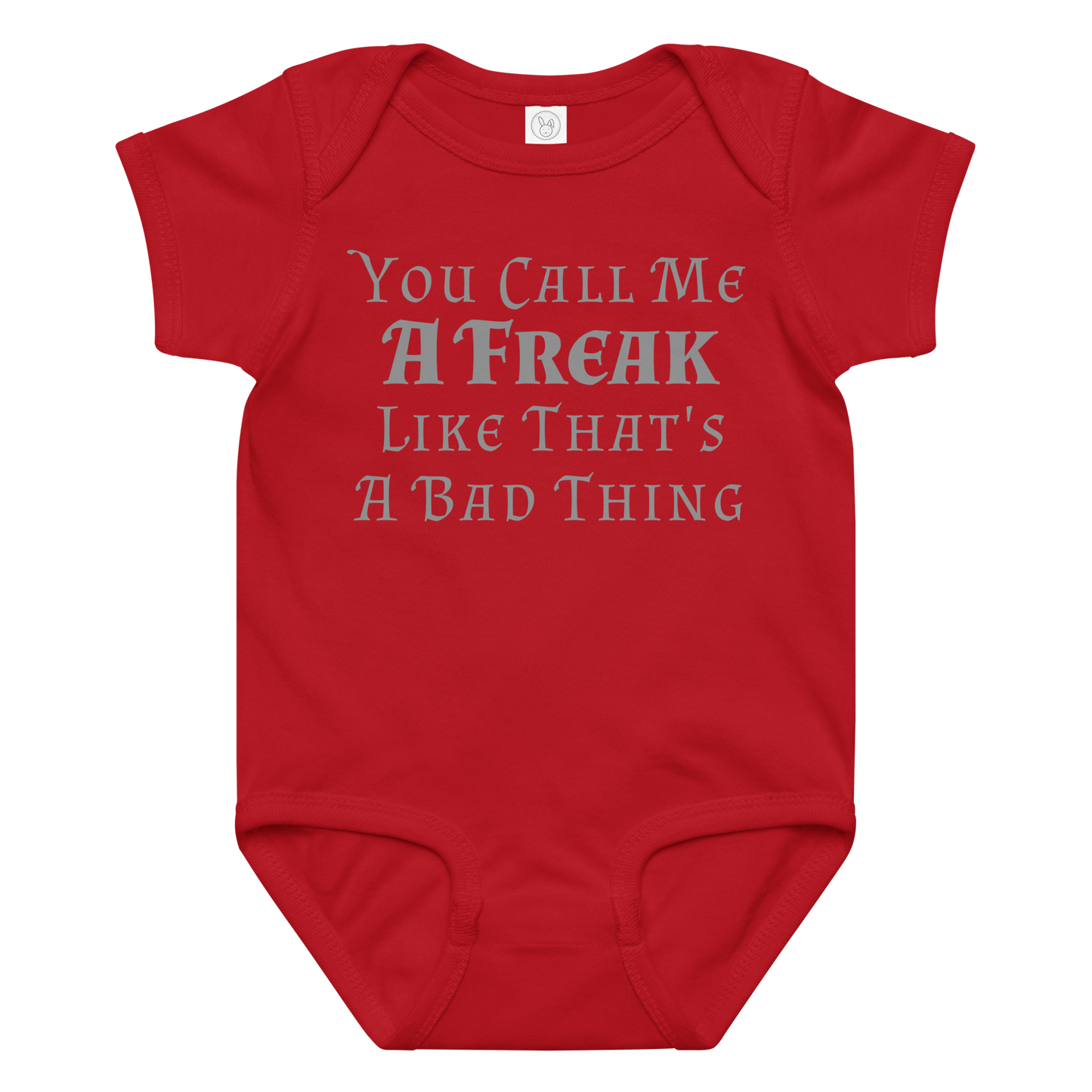 "You Call Me A Freak Like That's A Bad Thing" printed on a red baby jersey bodysuit laying on a flat surface amongst other clothes