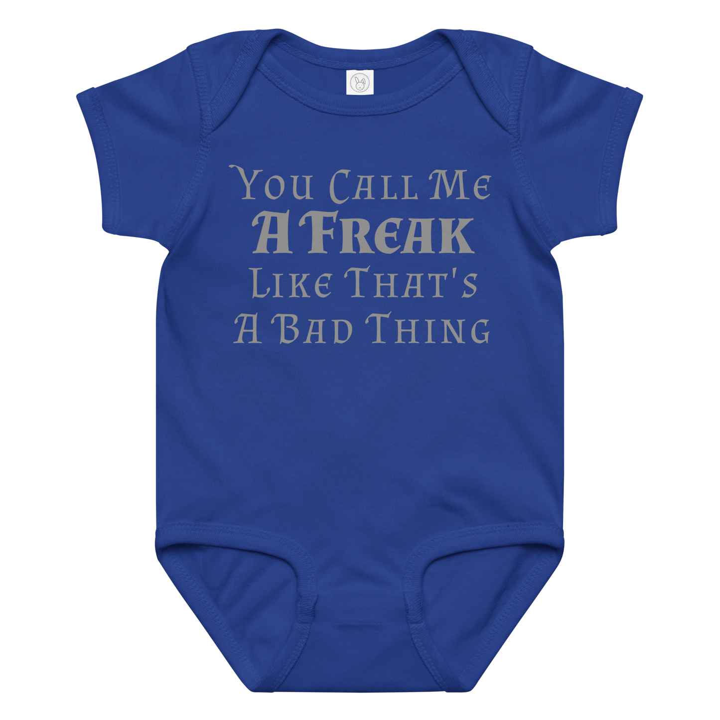 "You Call Me A Freak Like That's A Bad Thing" printed on a royal baby jersey bodysuit laying on a flat surface amongst other clothes