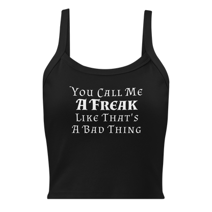 "You Call Me A Freak Like That's A Bad Thing" printed on a solid black blend women's micro-rib tanktop laying on a flat surface