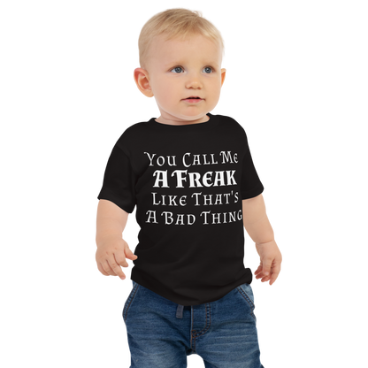 "You Call Me A Freak Like That's A Bad Thing" printed on a black baby jersey short sleeve tee worn by a male