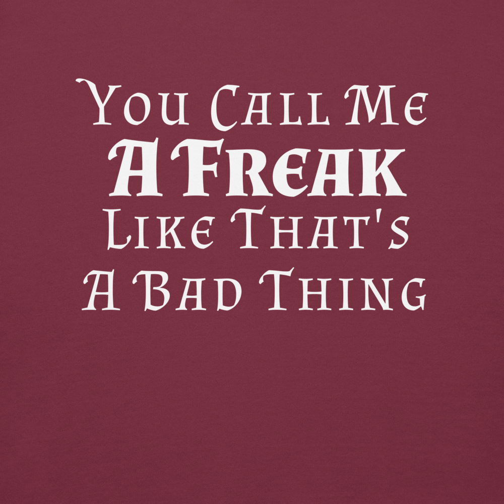"You Call Me A Freak Like That's A Bad Thing" printed on a maroon background