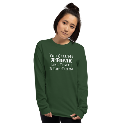 "You Call Me A Freak Like That's A Bad Thing" printed on a forest green men's long sleeve shirt worn by a female