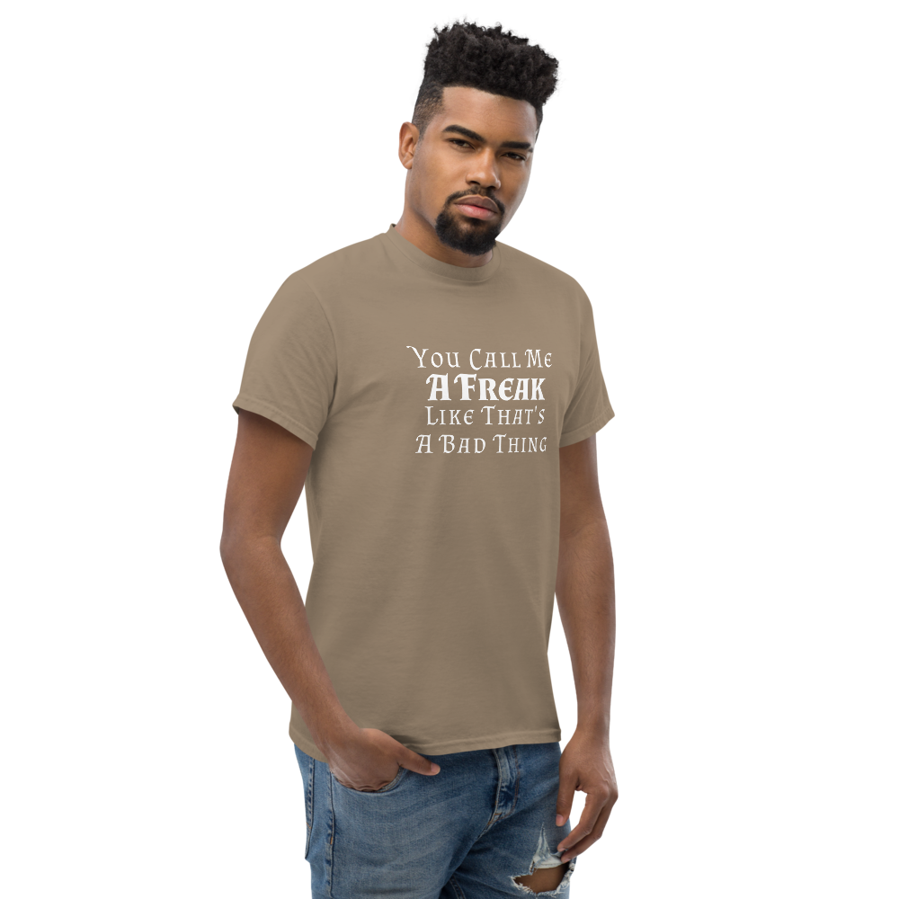 "You Call Me A Freak Like That's A Bad Thing" printed on a brown savana unisex classic tee worn by a male