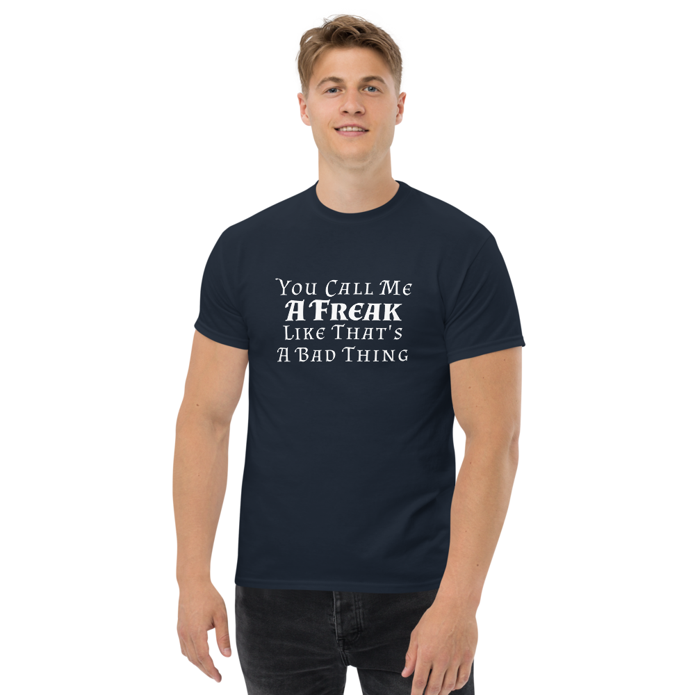 "You Call Me A Freak Like That's A Bad Thing" printed on a navy unisex classic tee worn by a male
