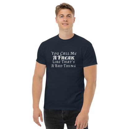 "You Call Me A Freak Like That's A Bad Thing" printed on a navy unisex classic tee worn by a male