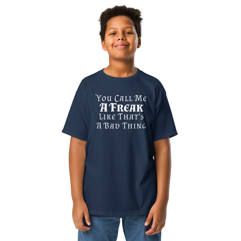 "You Call Me A Freak Like That's A Bad Thing" printed on a navy youth classic tee worn by a male