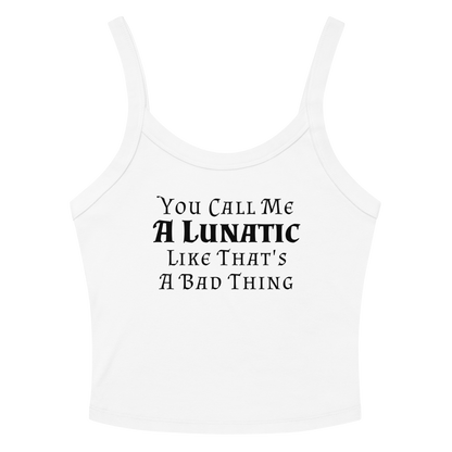"You Call Me A Lunatic Like That's A Bad Thing" printed on a solid white blend women's micro-rib tanktop laying on a flat surface amongst sunglasses and shorts