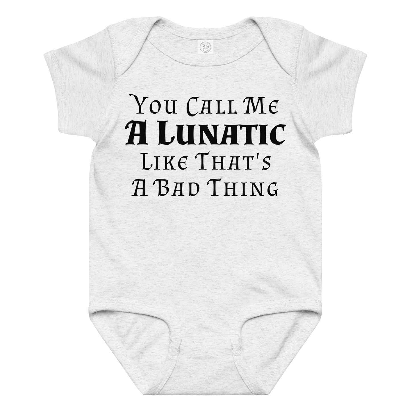 "You Call Me A Lunatic Like That's A Bad Thing" printed on a ash baby jersey bodysuit laying on a flat surface amongst other clothes