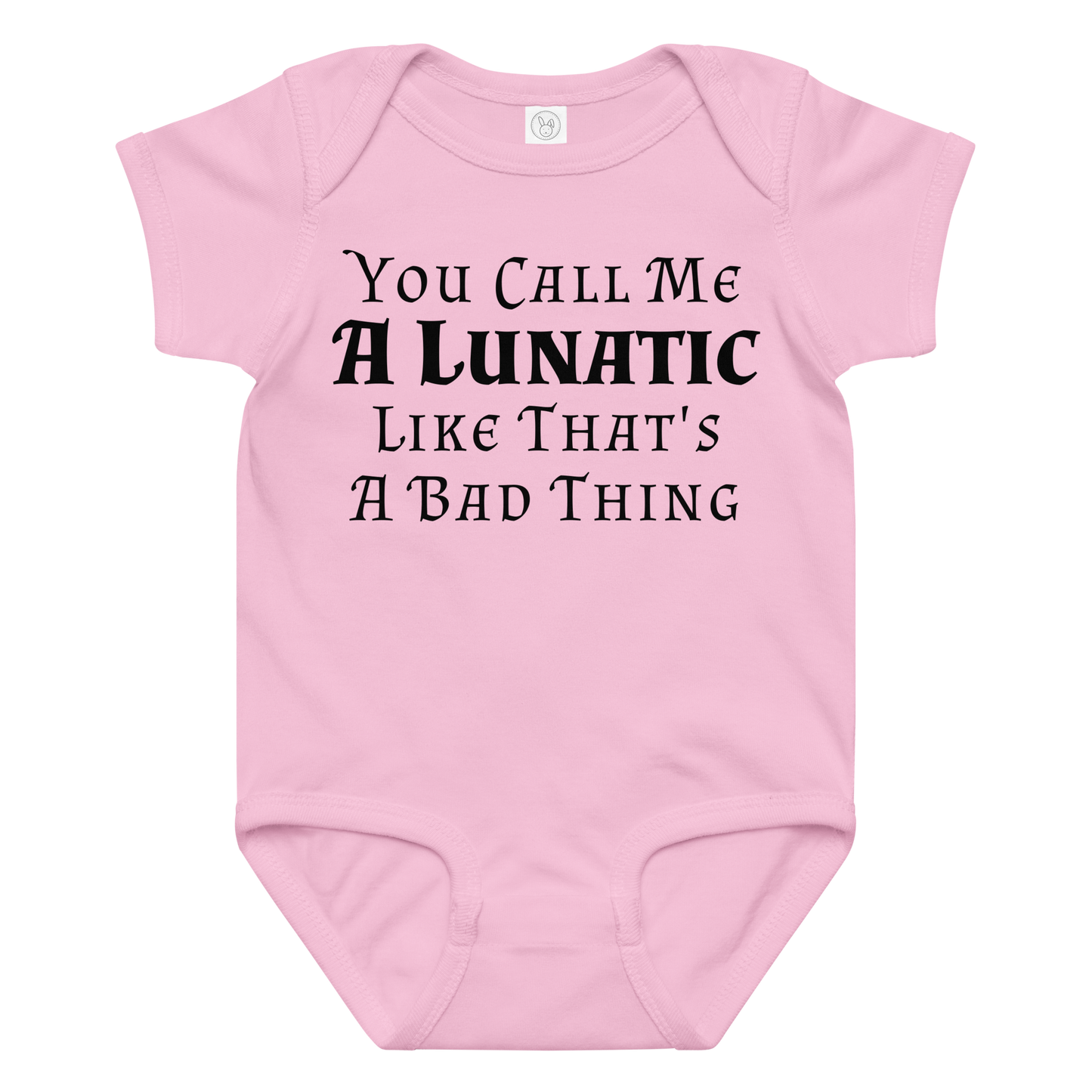 "You Call Me A Lunatic Like That's A Bad Thing" printed on a pink baby jersey bodysuit laying on a flat surface amongst other clothes