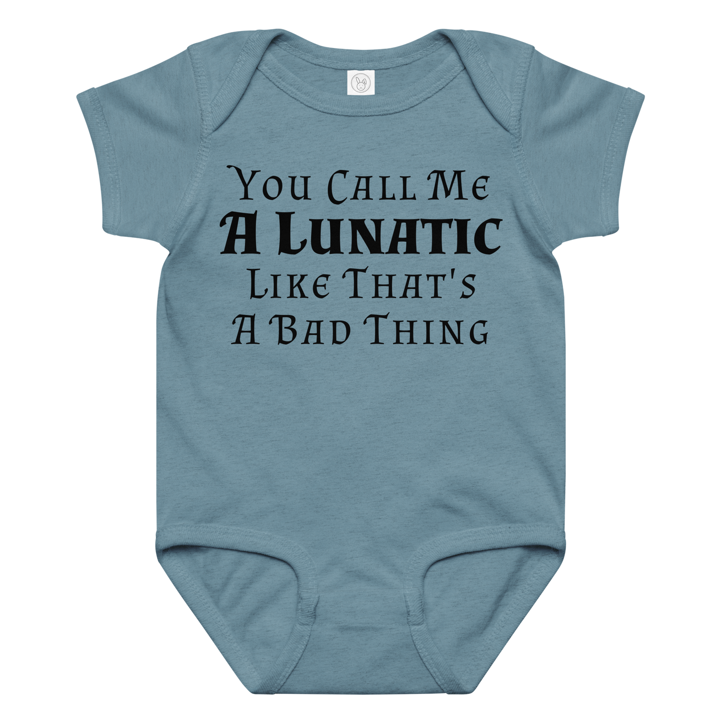 "You Call Me A Lunatic Like That's A Bad Thing" printed on a vintage indigo baby jersey bodysuit laying on a flat surface amongst other clothes