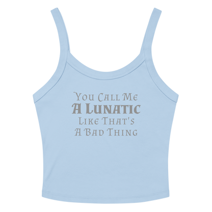 "You Call Me A Lunatic Like That's A Bad Thing" printed on a solid baby blue blend women's micro-rib tanktop laying on a flat surface amongst sunglasses and shorts