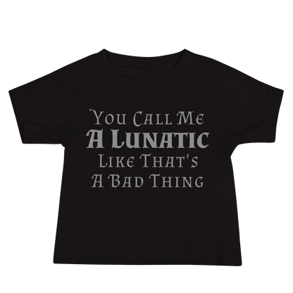 "You Call Me A Lunatic Like That's A Bad Thing" printed on a black baby jersey short sleeve tee laying on a flat surface