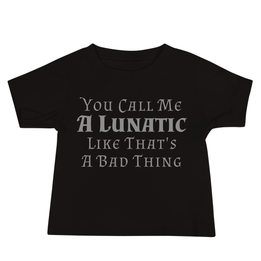 "You Call Me A Lunatic Like That's A Bad Thing" printed on a black baby jersey short sleeve tee laying on a flat surface