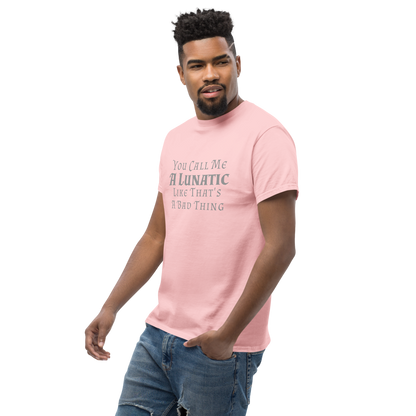 "You Call Me A Lunatic Like That's A Bad Thing" printed on a light pink unisex classic tee worn by a male