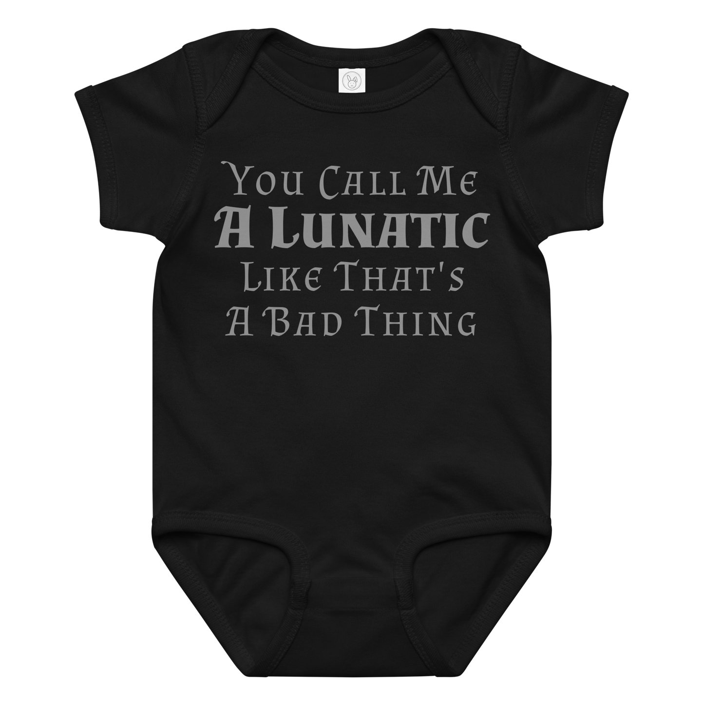 "You Call Me A Lunatic Like That's A Bad Thing" printed on a black baby jersey bodysuit laying on a flat surface amongst other clothes