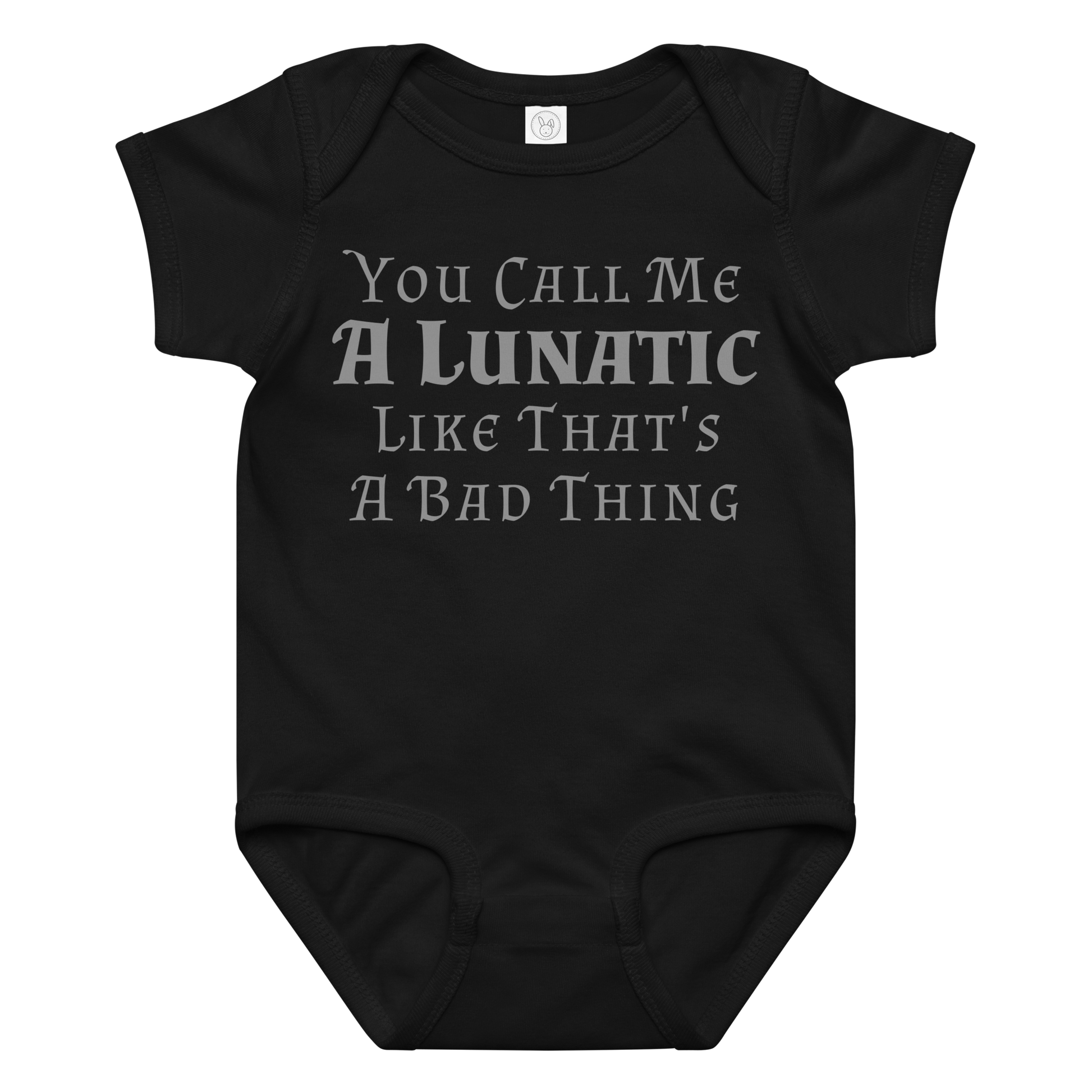 "You Call Me A Lunatic Like That's A Bad Thing" printed on a black baby jersey bodysuit laying on a flat surface amongst other clothes