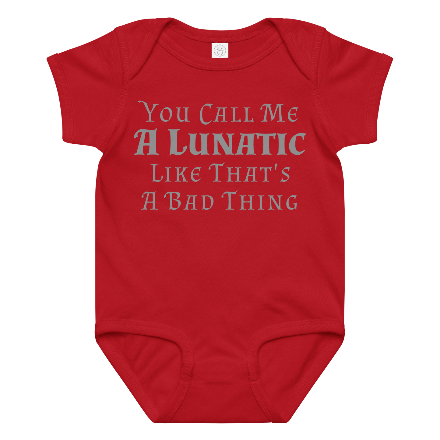 "You Call Me A Lunatic Like That's A Bad Thing" printed on a red baby jersey bodysuit laying on a flat surface amongst other clothes