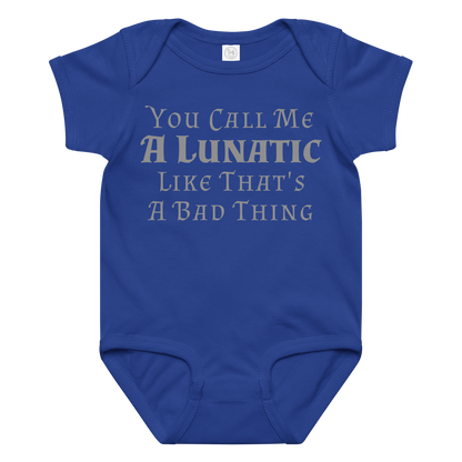 "You Call Me A Lunatic Like That's A Bad Thing" printed on a royal baby jersey bodysuit laying on a flat surface amongst other clothes