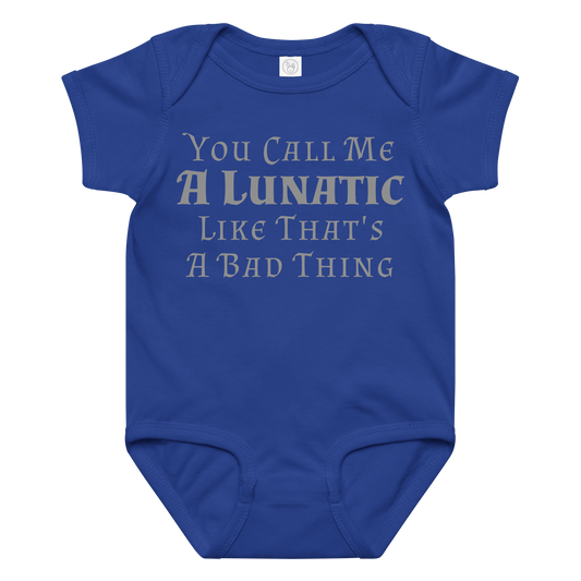 "You Call Me A Lunatic Like That's A Bad Thing" printed on a royal baby jersey bodysuit laying on a flat surface amongst other clothes