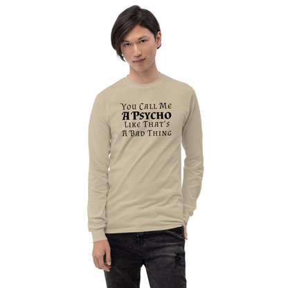 "You Call Me A Psycho Like That's A Bad Thing" printed on a sand men's long sleeve shirt worn by a male