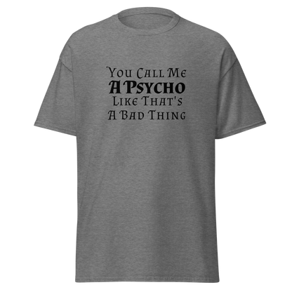 "You Call Me A Psycho Like That's A Bad Thing" printed on a graphite heather unisex classic tee laying on a flat surface