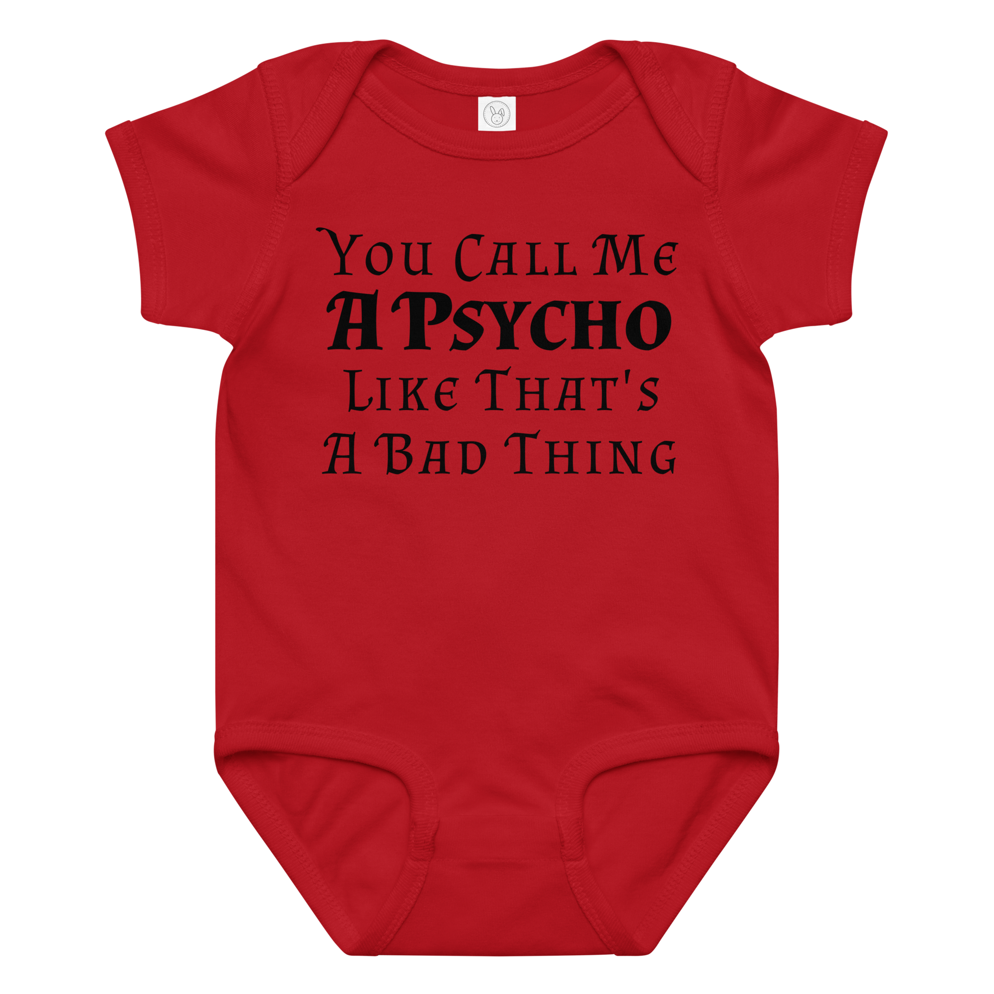 "You Call Me A Psycho Like That's A Bad Thing" printed on a red baby jersey bodysuit laying on a flat surface amongst other clothes