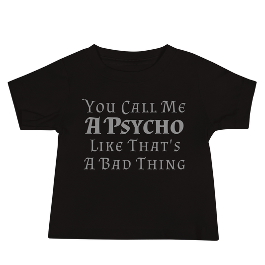 "You Call Me A Psycho Like That's A Bad Thing" printed on a black baby jersey short sleeve tee laying on a flat surface