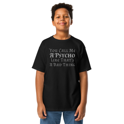 "You Call Me A Psycho Like That's A Bad Thing" printed on a black youth classic tee worn by a male