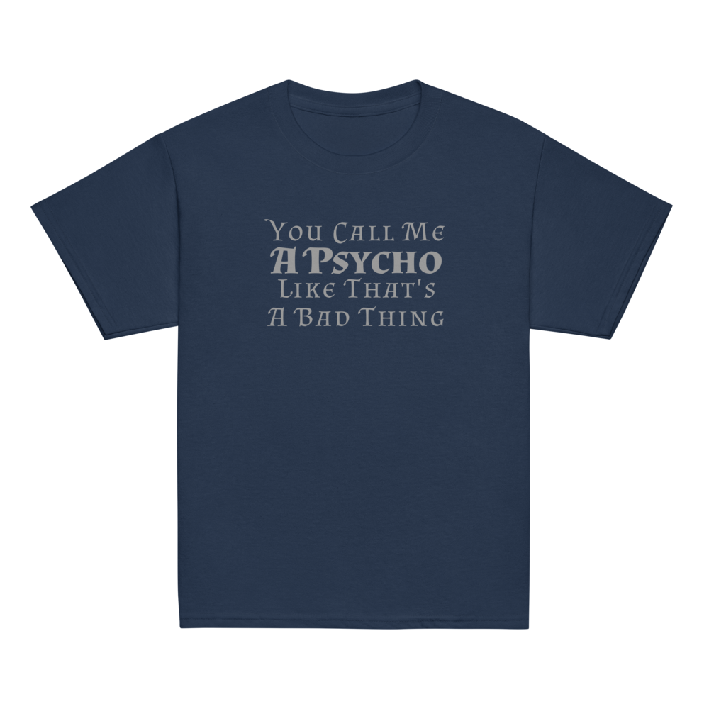 "You Call Me A Psycho Like That's A Bad Thing" printed on a navy youth classic tee laying on a flat surface