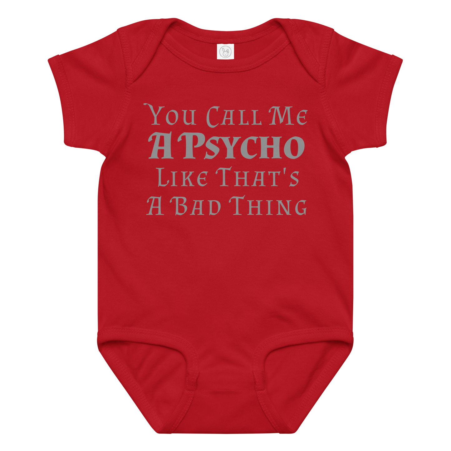 "You Call Me A Psycho Like That's A Bad Thing" printed on a red baby jersey bodysuit laying on a flat surface amongst other clothes