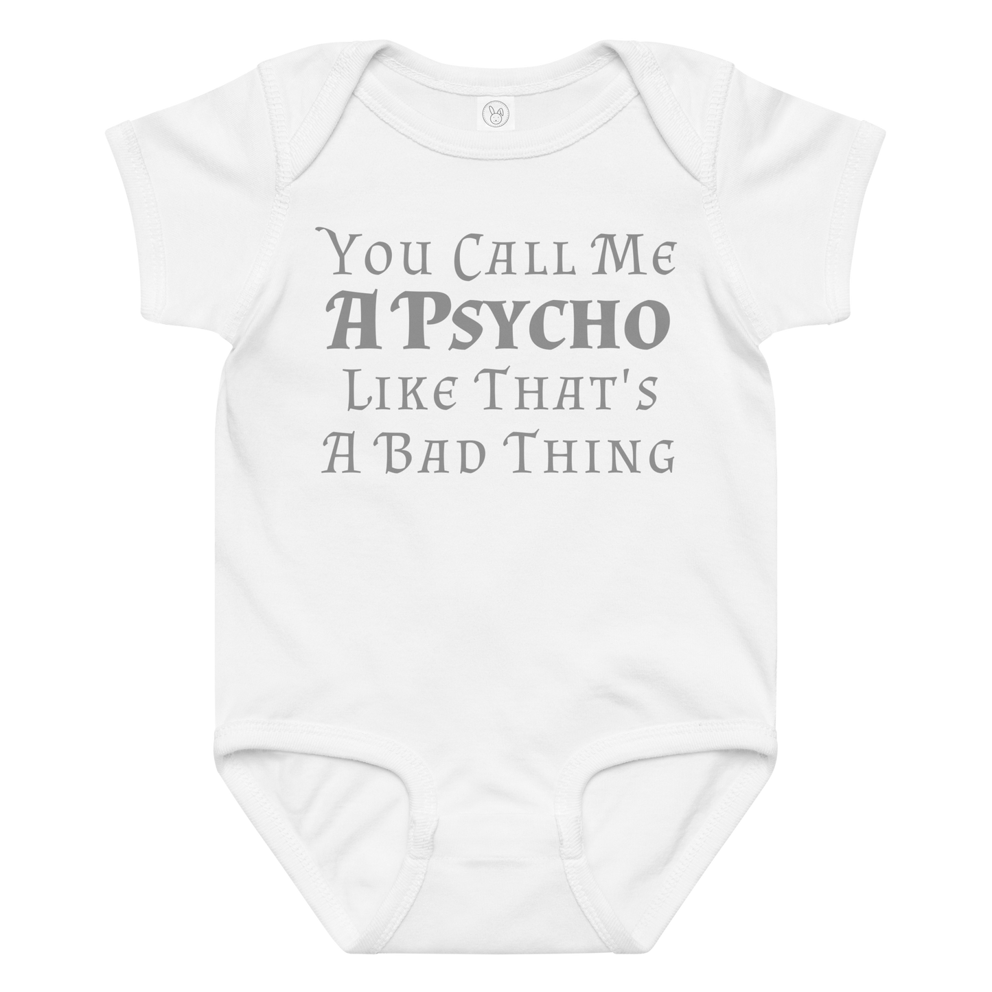 "You Call Me A Psycho Like That's A Bad Thing" printed on a white baby jersey bodysuit laying on a flat surface amongst other clothes