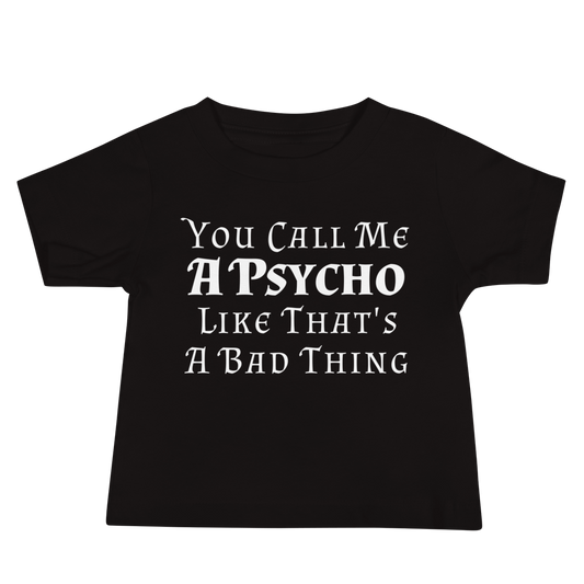 "You Call Me A Psycho Like That's A Bad Thing" printed on a black baby jersey short sleeve tee laying on a flat surface