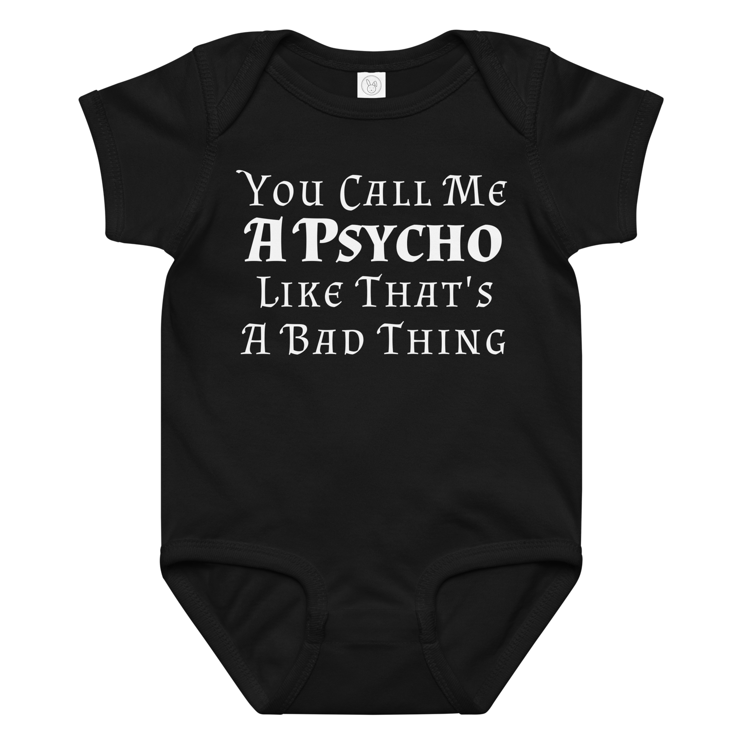"You Call Me A Psycho Like That's A Bad Thing" printed on a black baby jersey bodysuit laying on a flat surface amongst other clothes