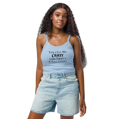 "You Call Me Crazy Like That's A Bad Thing" printed on a solid baby blue blend women's micro-rib tanktop worn by a female