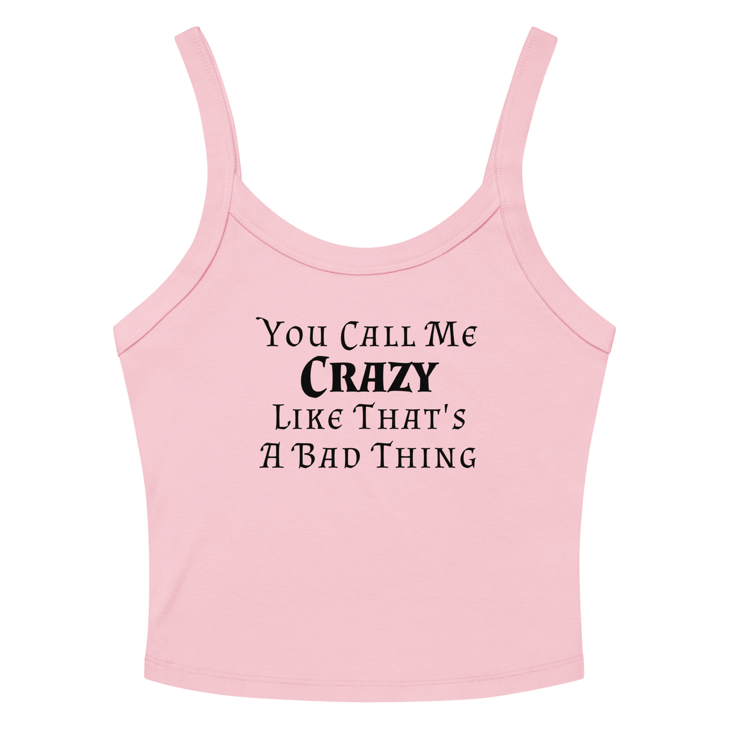 "You Call Me Crazy Like That's A Bad Thing" printed on a solid pink blend women's micro-rib tanktop laying on a flat surface amongst sunglasses and shorts