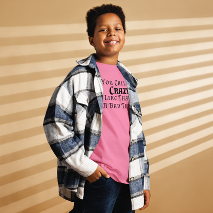 "You Call Me Crazy Like That's A Bad Thing" printed on a azalea youth classic tee worn by a male also wearing a jacket