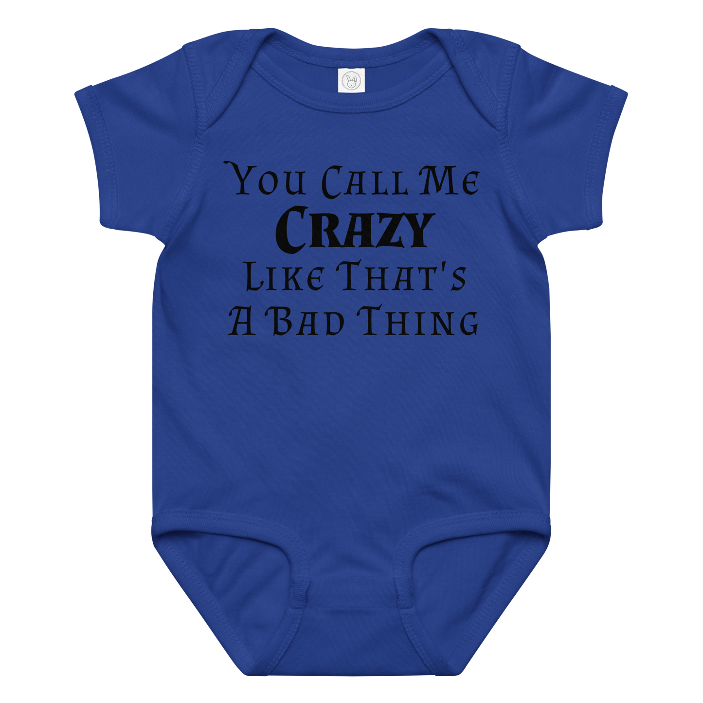 "You Call Me Crazy Like That's A Bad Thing" printed on a royal baby jersey bodysuit laying on a flat surface amongst other clothes