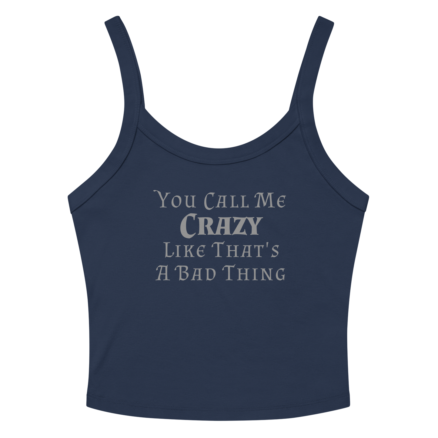 "You Call Me Crazy Like That's A Bad Thing" printed on a solid navy blend women's micro-rib tanktop laying on a flat surface amongst sunglasses and shorts