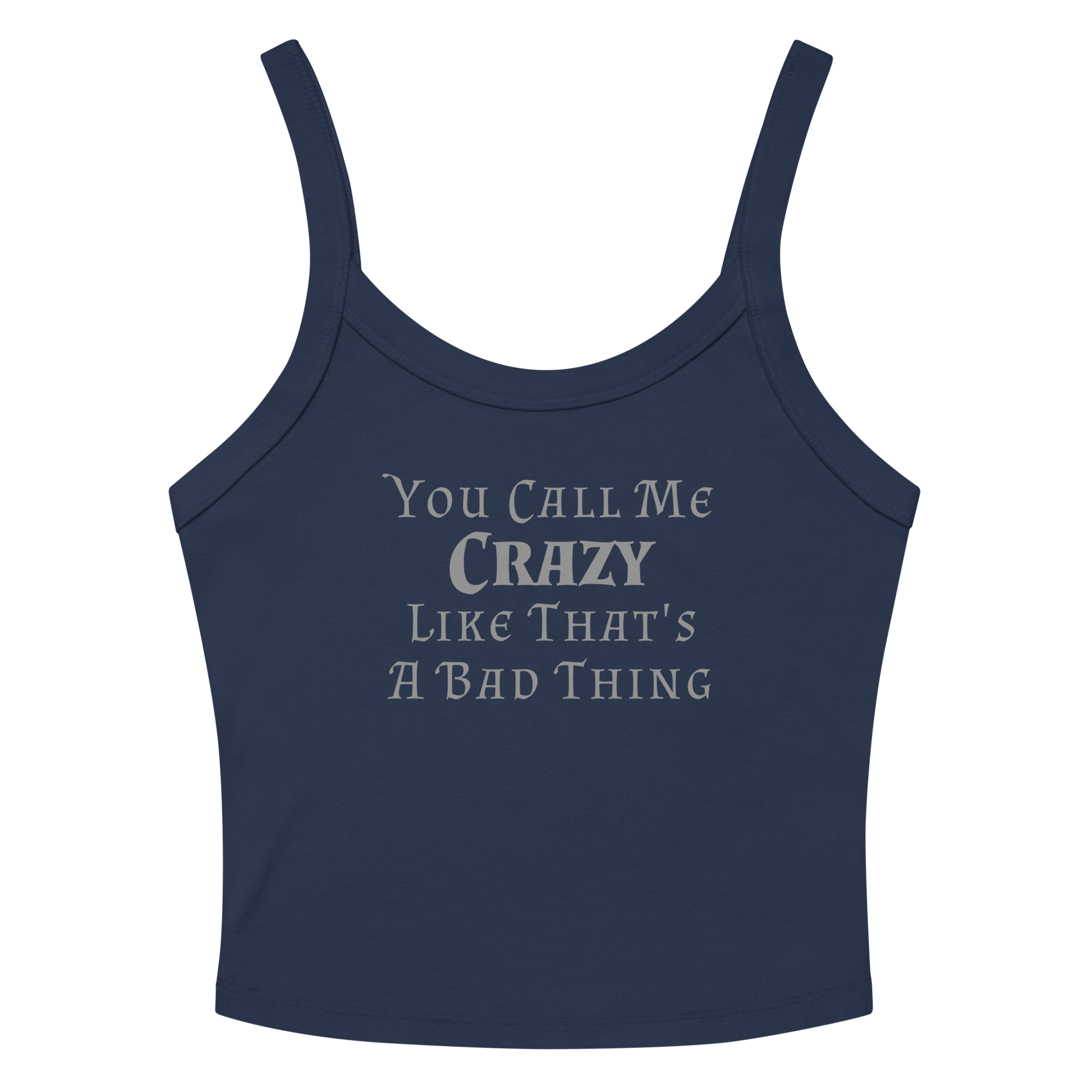 "You Call Me Crazy Like That's A Bad Thing" printed on a solid navy blend women's micro-rib tanktop laying on a flat surface amongst sunglasses and shorts
