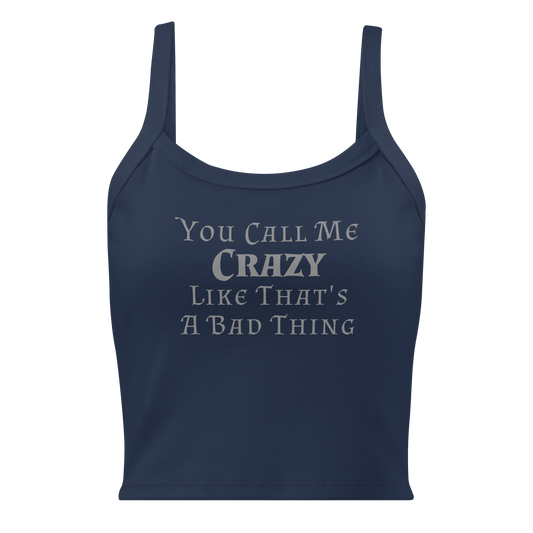 "You Call Me Crazy Like That's A Bad Thing" printed on a solid navy blend women's micro-rib tanktop laying on a flat surface