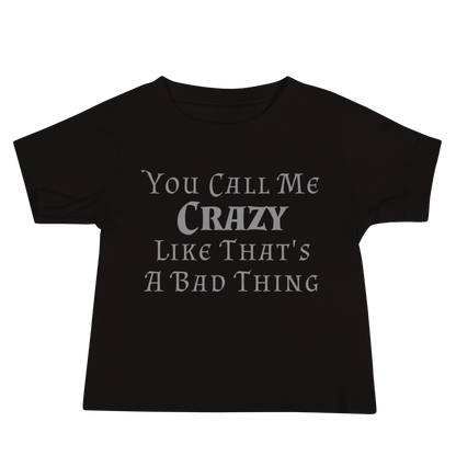 "You Call Me Crazy Like That's A Bad Thing" printed on a black baby jersey short sleeve tee laying on a flat surface