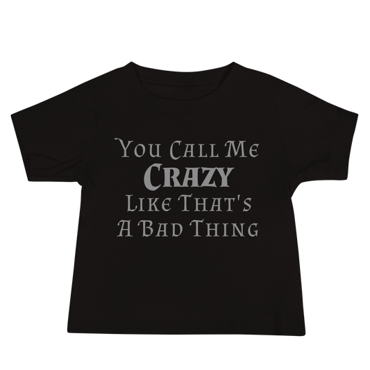 "You Call Me Crazy Like That's A Bad Thing" printed on a black baby jersey short sleeve tee laying on a flat surface