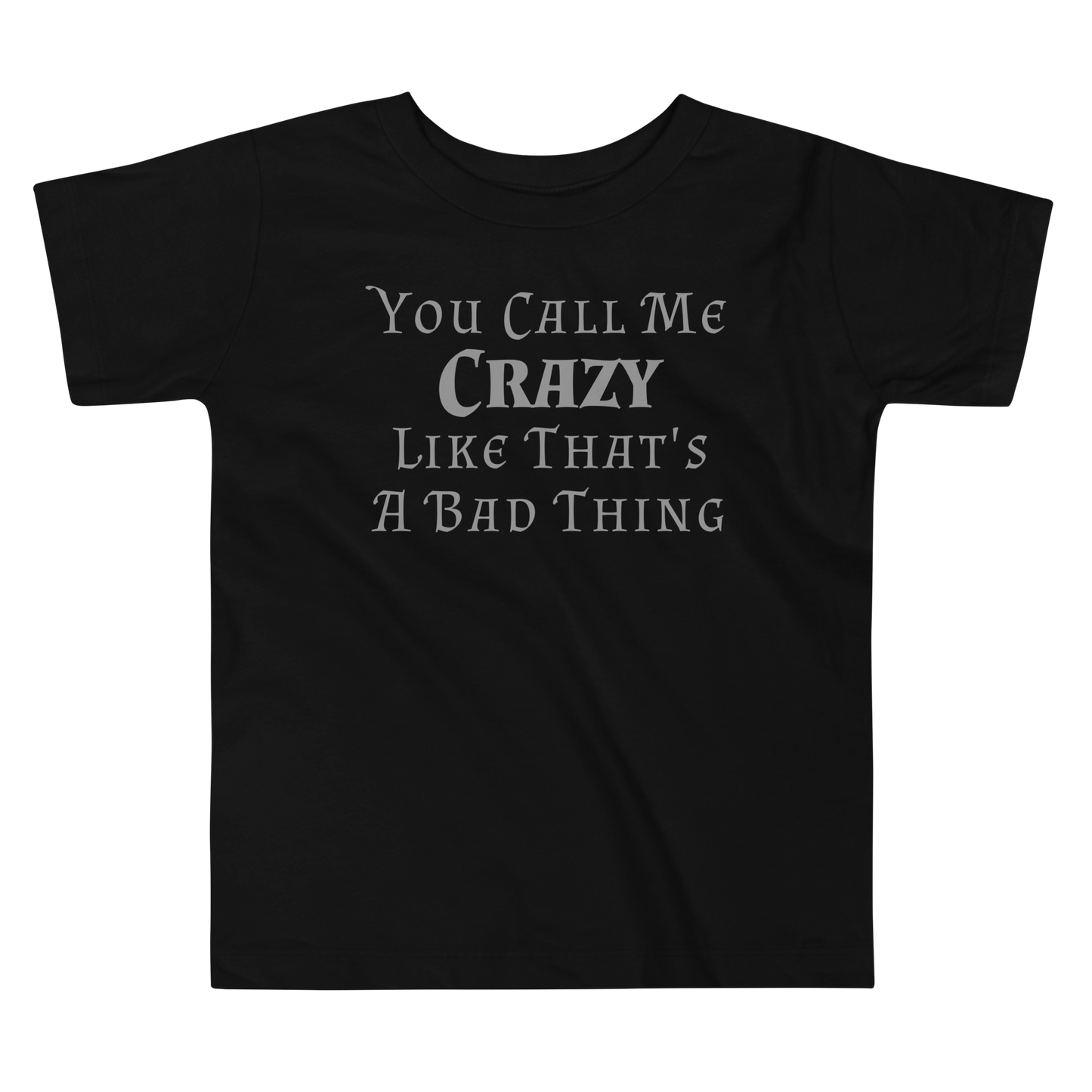 "You Call Me Crazy Like That's A Bad Thing" printed on a black toddler short sleeve tee laying on a flat surface