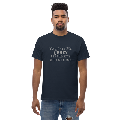 "You Call Me Crazy Like That's A Bad Thing" printed on a navy unisex classic tee worn by a male