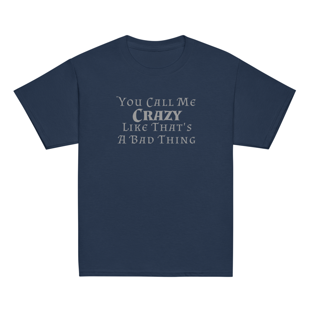 "You Call Me Crazy Like That's A Bad Thing" printed on a navy youth classic tee laying on a flat surface
