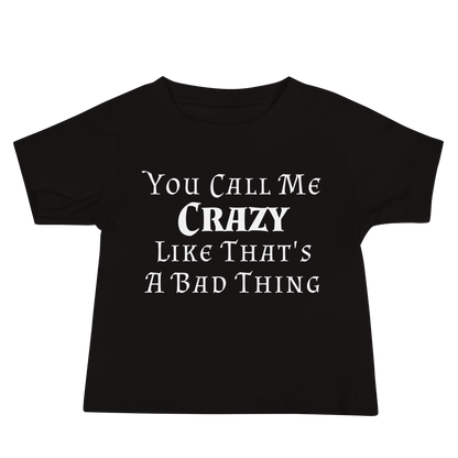 "You Call Me Crazy Like That's A Bad Thing" printed on a black baby jersey short sleeve tee laying on a flat surface